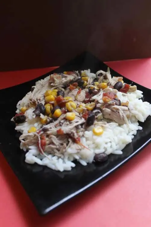 Easy recipe for your slow cooker or crock pot cooking. Santa Fe Chicken is an easy family meal that can be served over rice, chips or eaten as is. #slowcookerrecipes