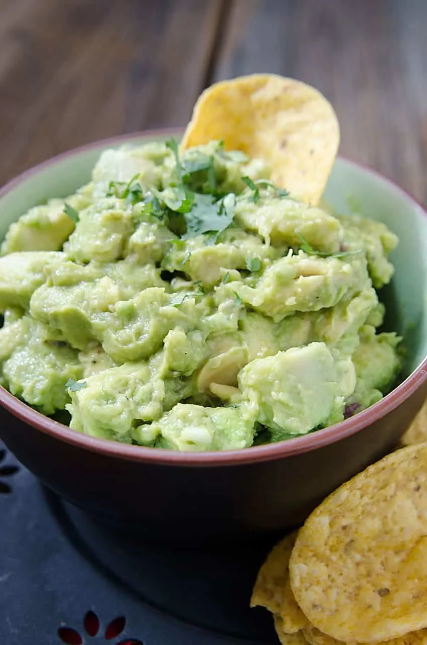 Homemade Guacamole is an easy to make recipe that is low in points and packed with added nutritional value. Fruit, veggie, who cares! Avocados are delicious