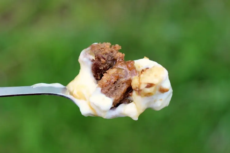 apple walnut bread pudding on a spoon