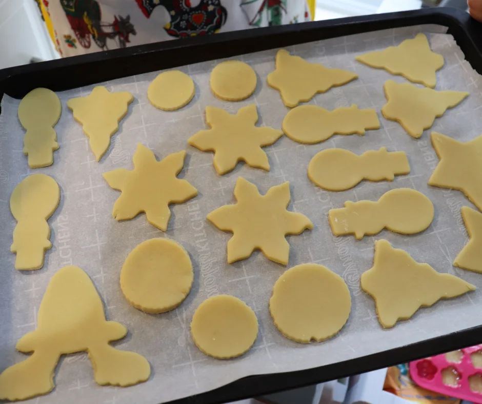 cookies on a lined baking sheet ready for the oven. 