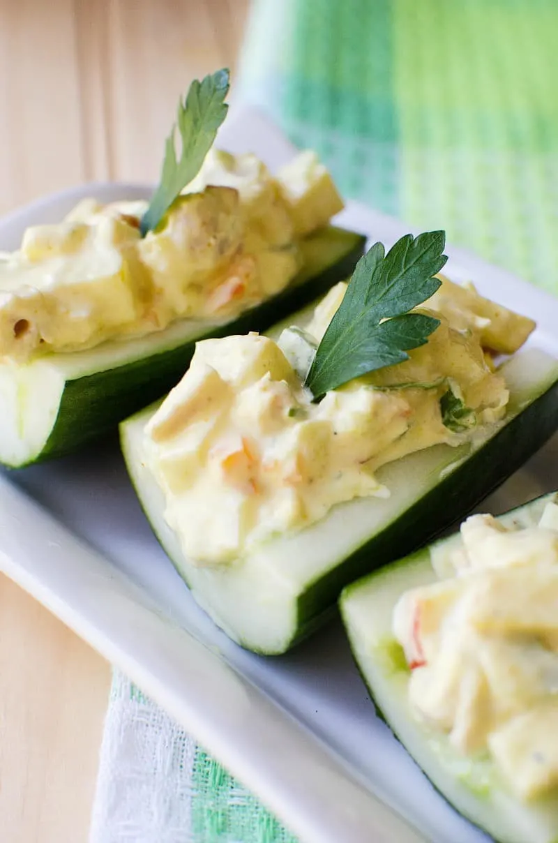 Try this fresh and tasty Curry Chicken and Apple Salad Recipe at your next party. Serve these fun finger "sandwiches" made in cucumber boats. 
