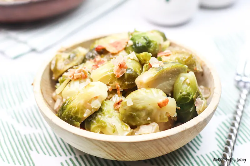 a bowl full of the finished instant pot Brussels sprouts ready to eat. 