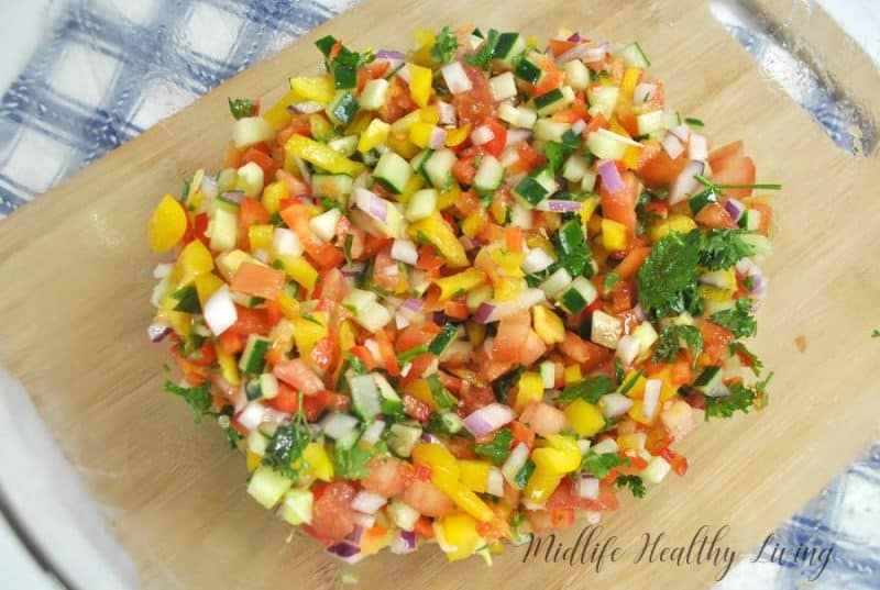 This Weight Watchers Mediterranean salad is light and delicious. It's a great summer side dish. It's healthy too, just 1 Freestyle Smart Point per serving!