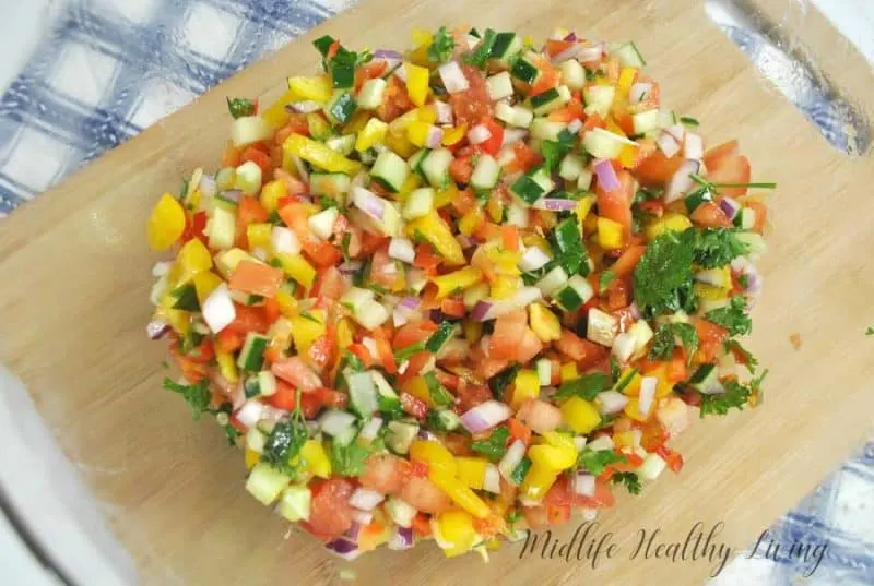 This Weight Watchers Mediterranean salad is light and delicious. It's a great summer side dish. It's healthy too, just 1 Freestyle Smart Point per serving!