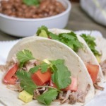 Need a quick and easy weeknight meal that can feed a crowd? These slow cooker pork tacos are a great family dinner recipe. The Crockpot does all the hard work, taco night has never tasted so good! 