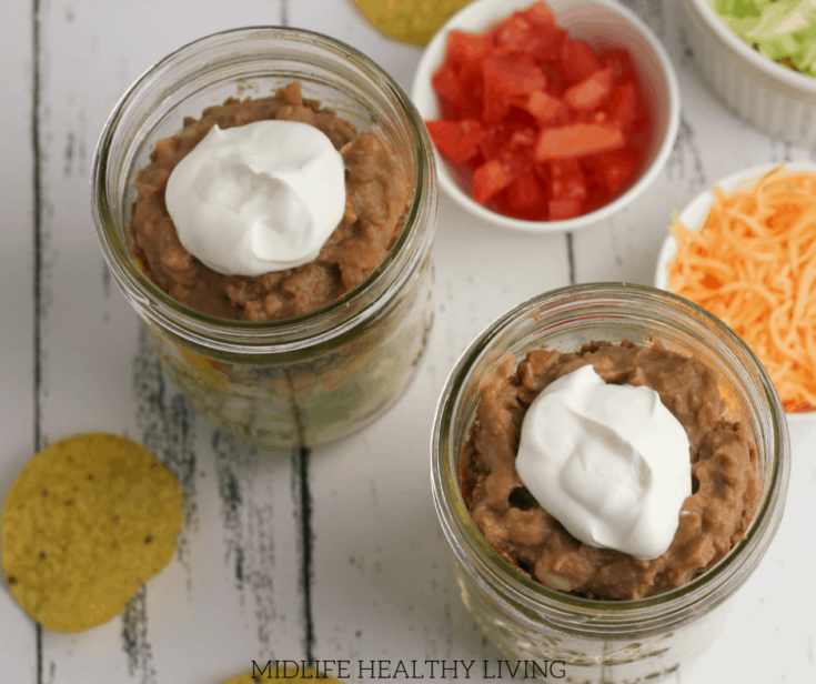 Have you tried making mason jar salads?! Give this taco salad in a jar a try and you'll be hooked! This easy to make and prep salad is the perfect Weight Watchers lunch recipe.