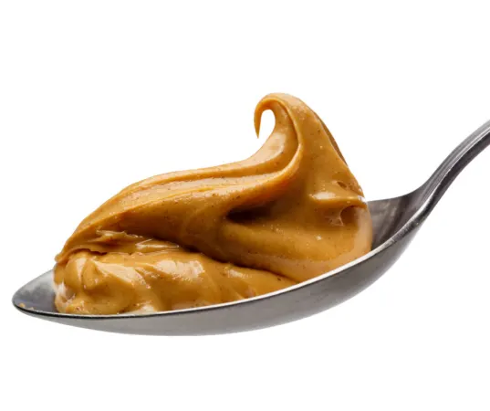creamy peanut butter on a spoon. 