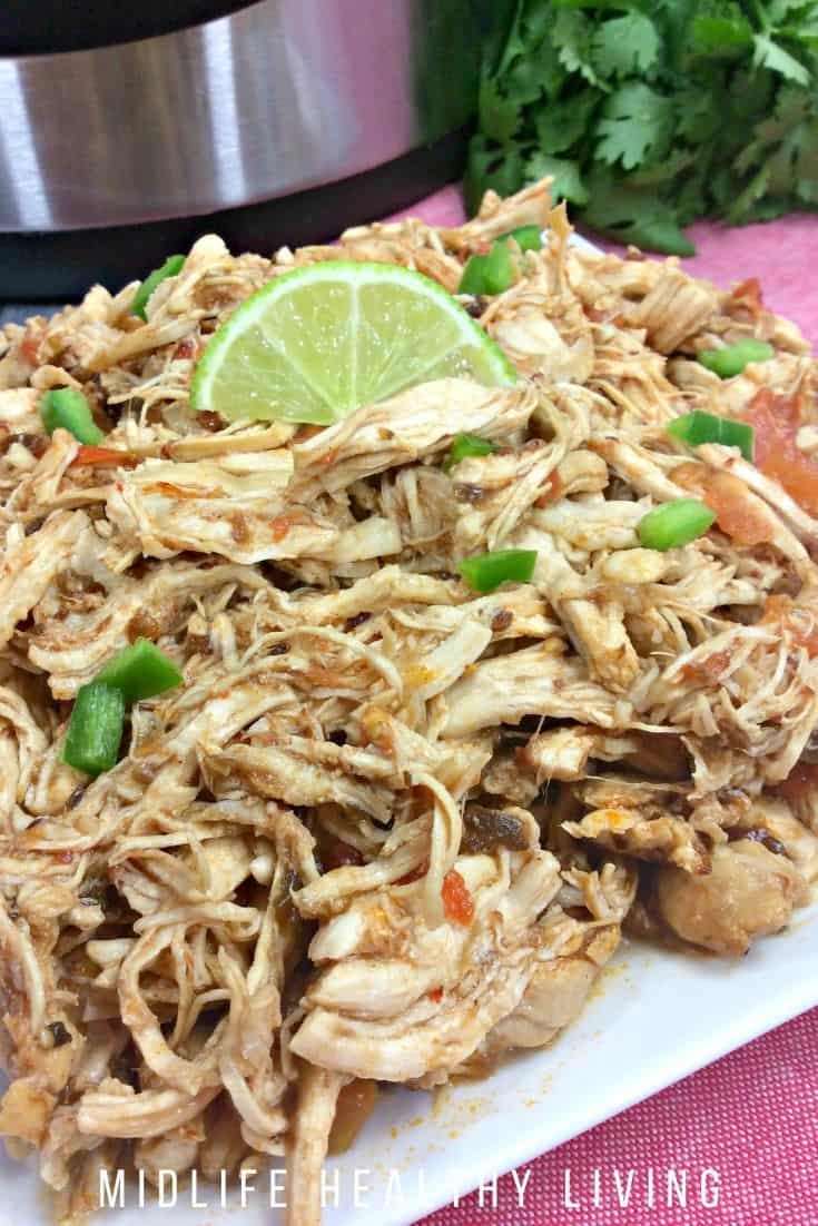Vertical image showing finished Mexican shredded chicken recipe.