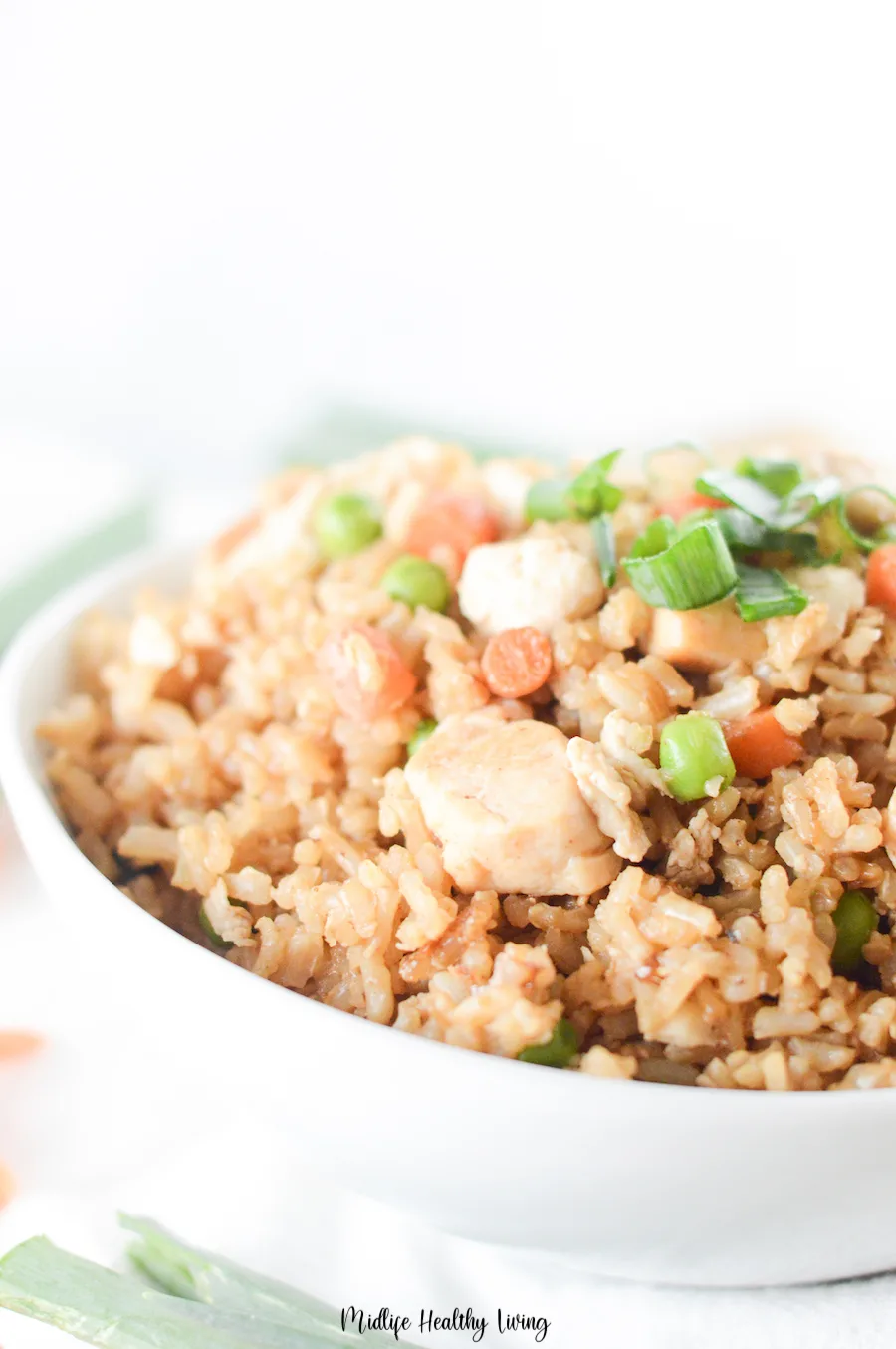 A close up of the finished result of how to make chicken fried rice. 