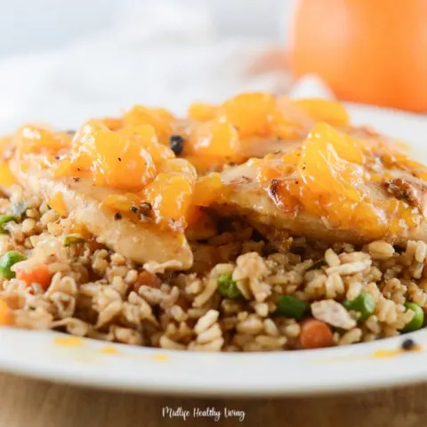 Featured Image showing the finished orange chicken on a plate with rice ready to eat.