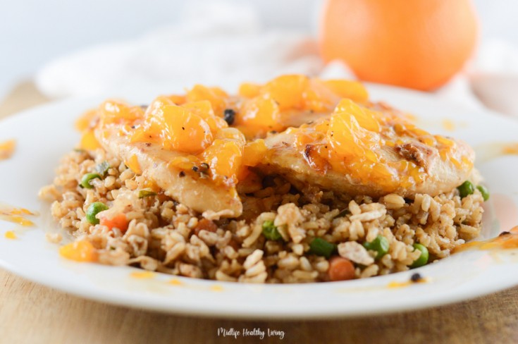 Featured Image showing the finished orange chicken on a plate with rice ready to eat.