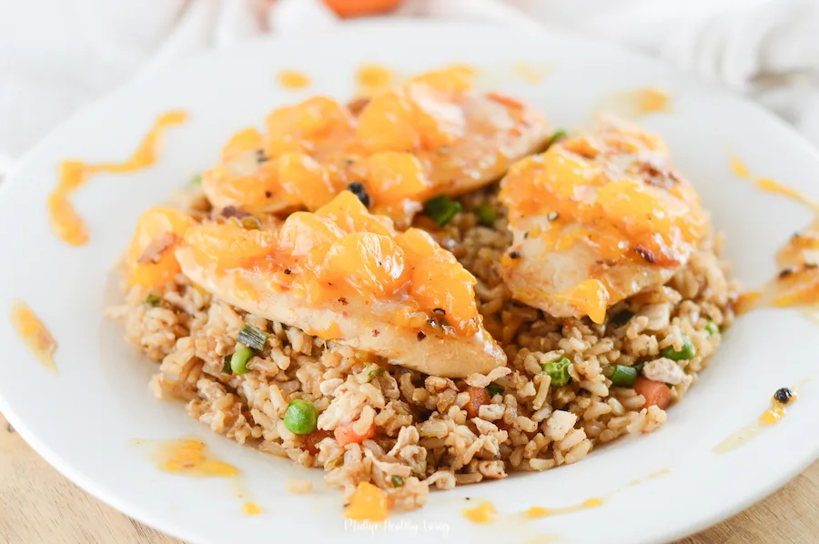 A close up shot of the finished orange chicken in a dish ready to be served.