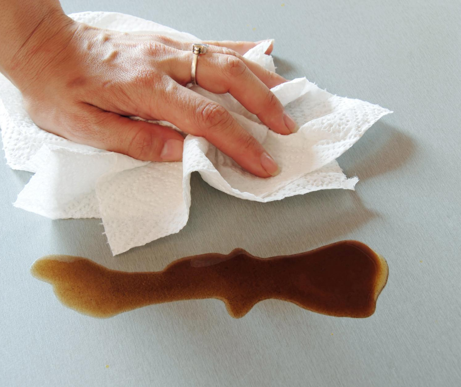 bleach wipes being used to clean up a spill in the kitchen. 