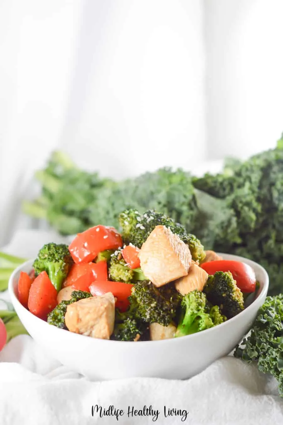 Another view of the finished chicken stir fry recipe in a bowl.