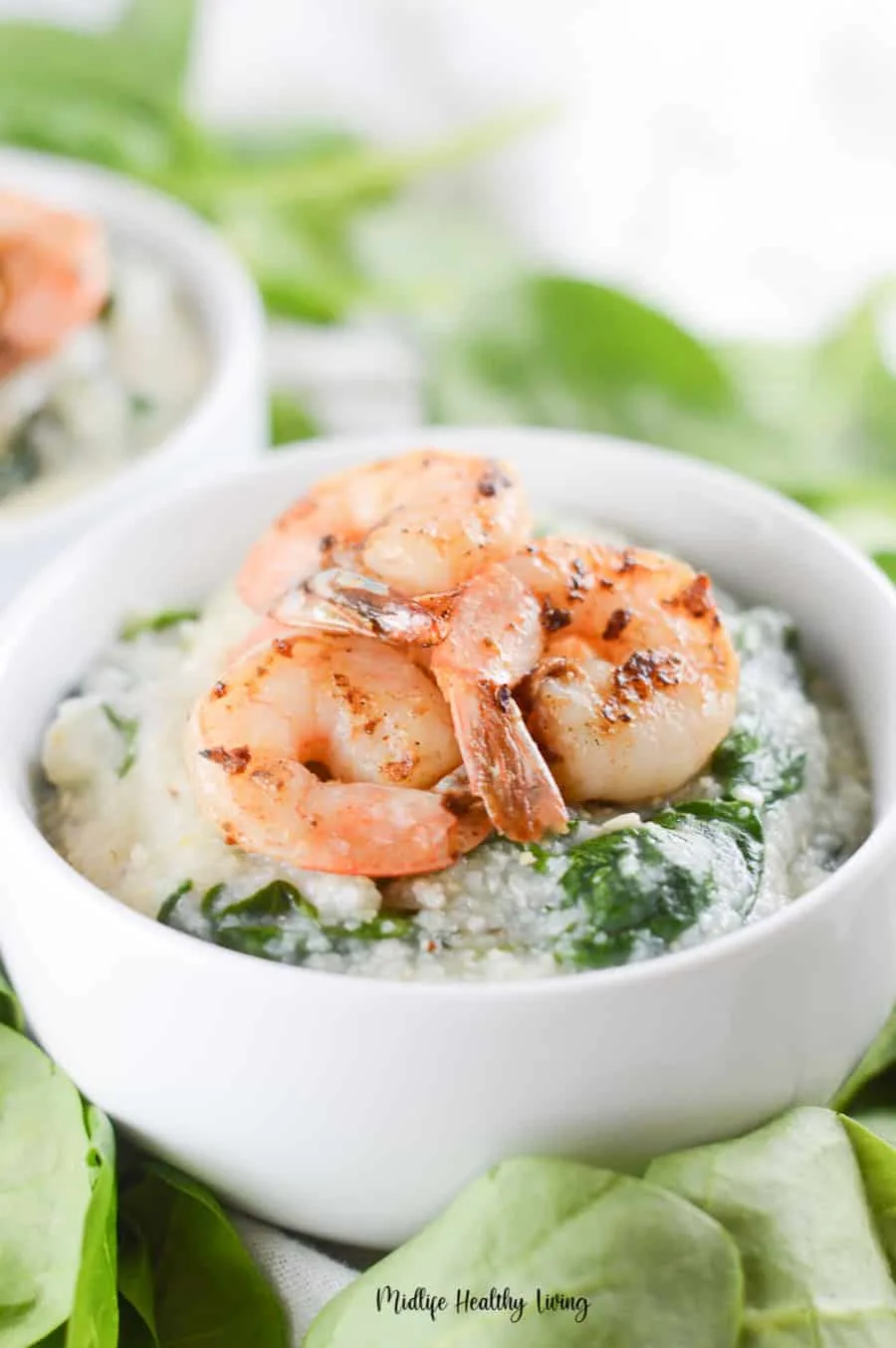 A close up shot of a bowl full of weight watchers grits with shrimp on top! 