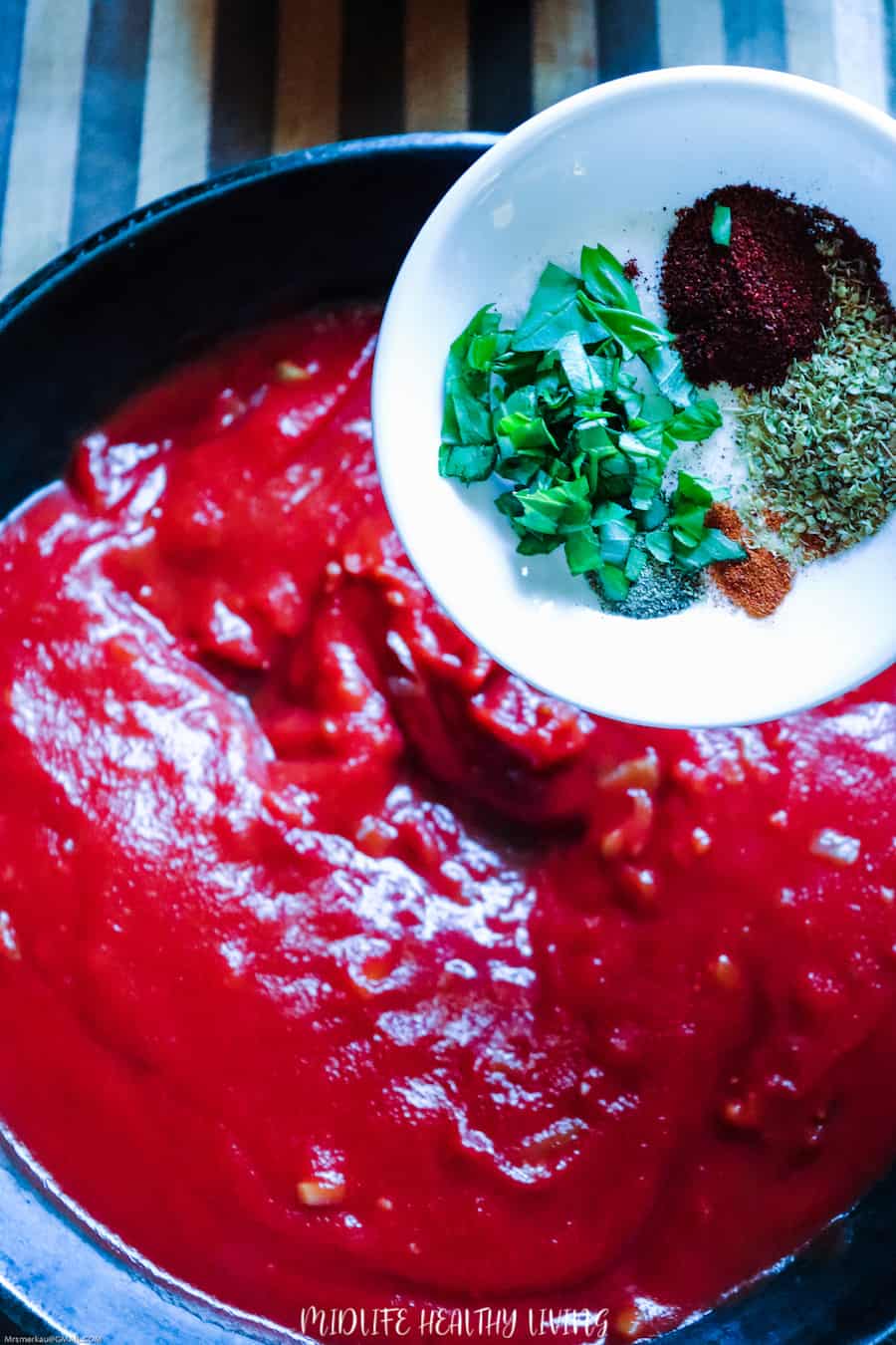 A look at the sauce being made, the pan is filling up with sauce ingredients. 