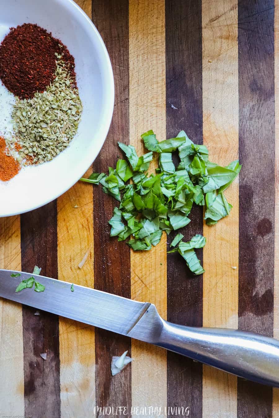 A look at the prep space as we chop the basil for our Weight Watchers spaghetti sauce recipe. 