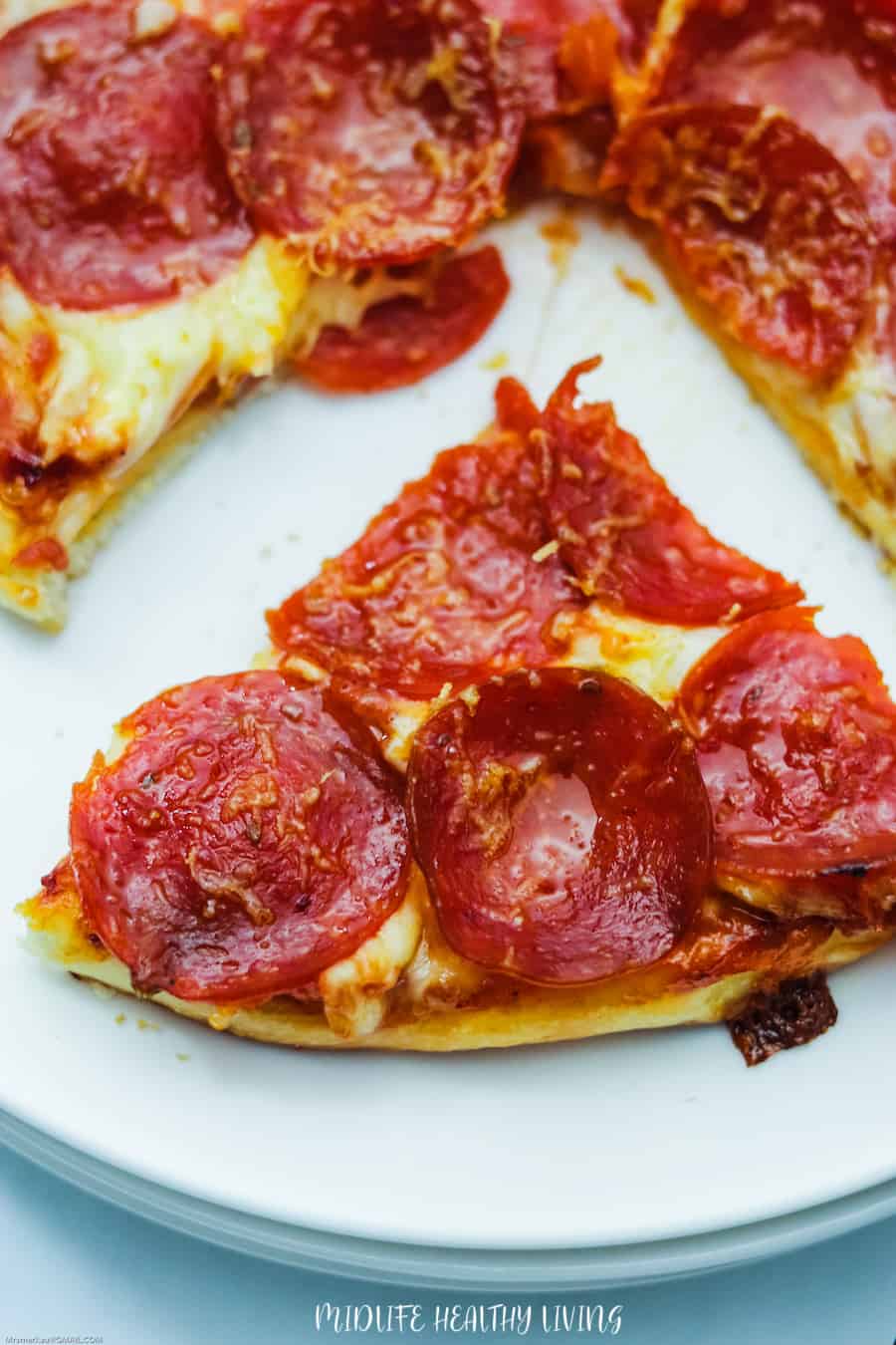 A slice of this delicious pizza recipe ready to be enjoyed. 