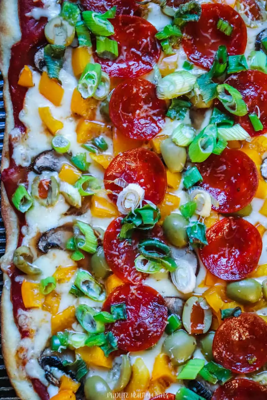 A top down look at a full sheet of pizza ready to be enjoyed. 