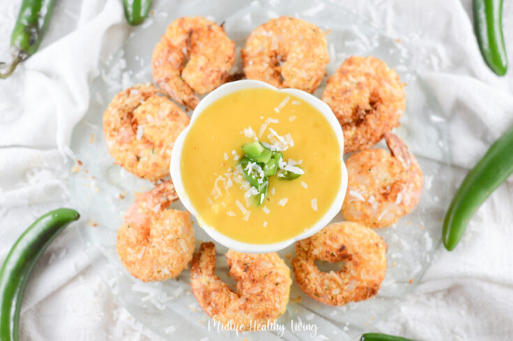 Featured image showing the finished weight watchers coconut shrimp arranged around some dipping sauce!