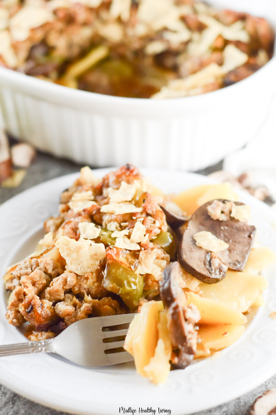 A close up view of a plate full of the delicious casserole ready to eat. 