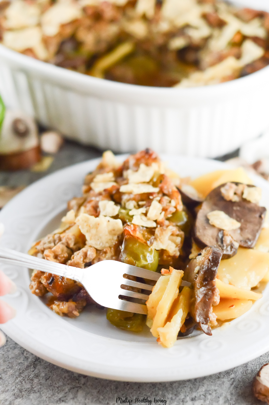 A serving of the casserole ready to be eaten with a fork.