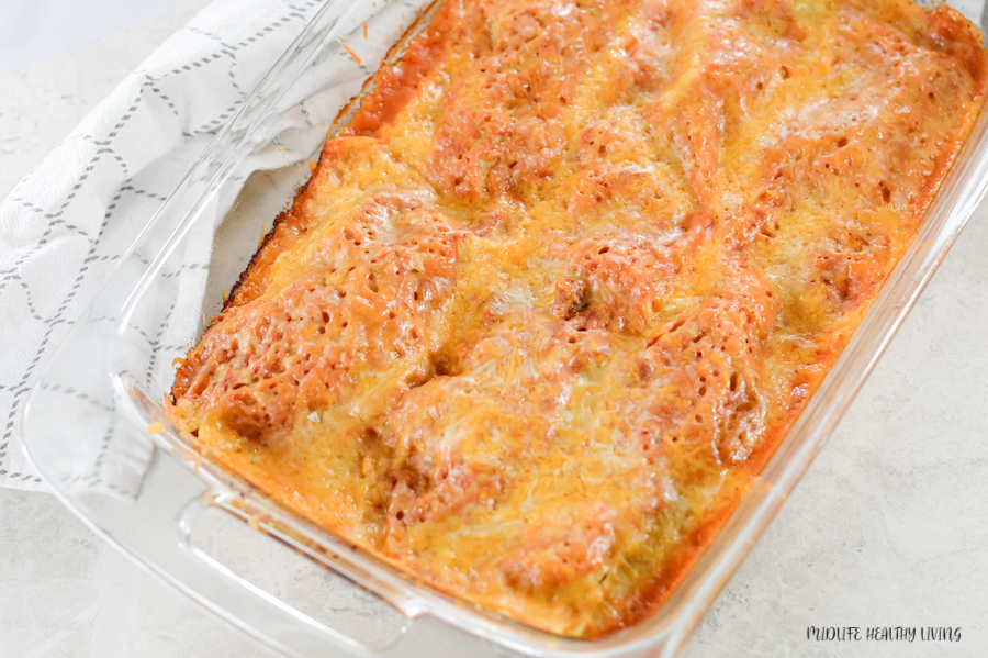 A top down look at the finished pan of beef enchiladas ready to serve. 