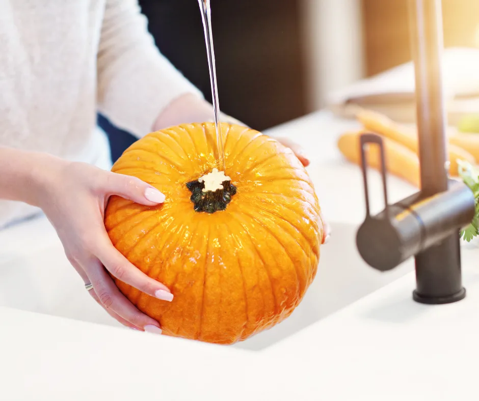 pumpkin being washed. 