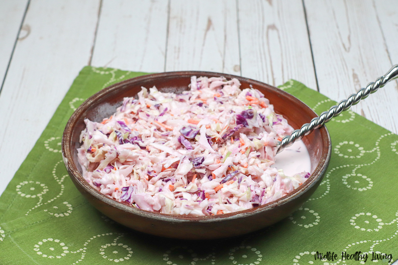 Another look at a bowl full of the finished recipe for coleslaw ready to serve.
