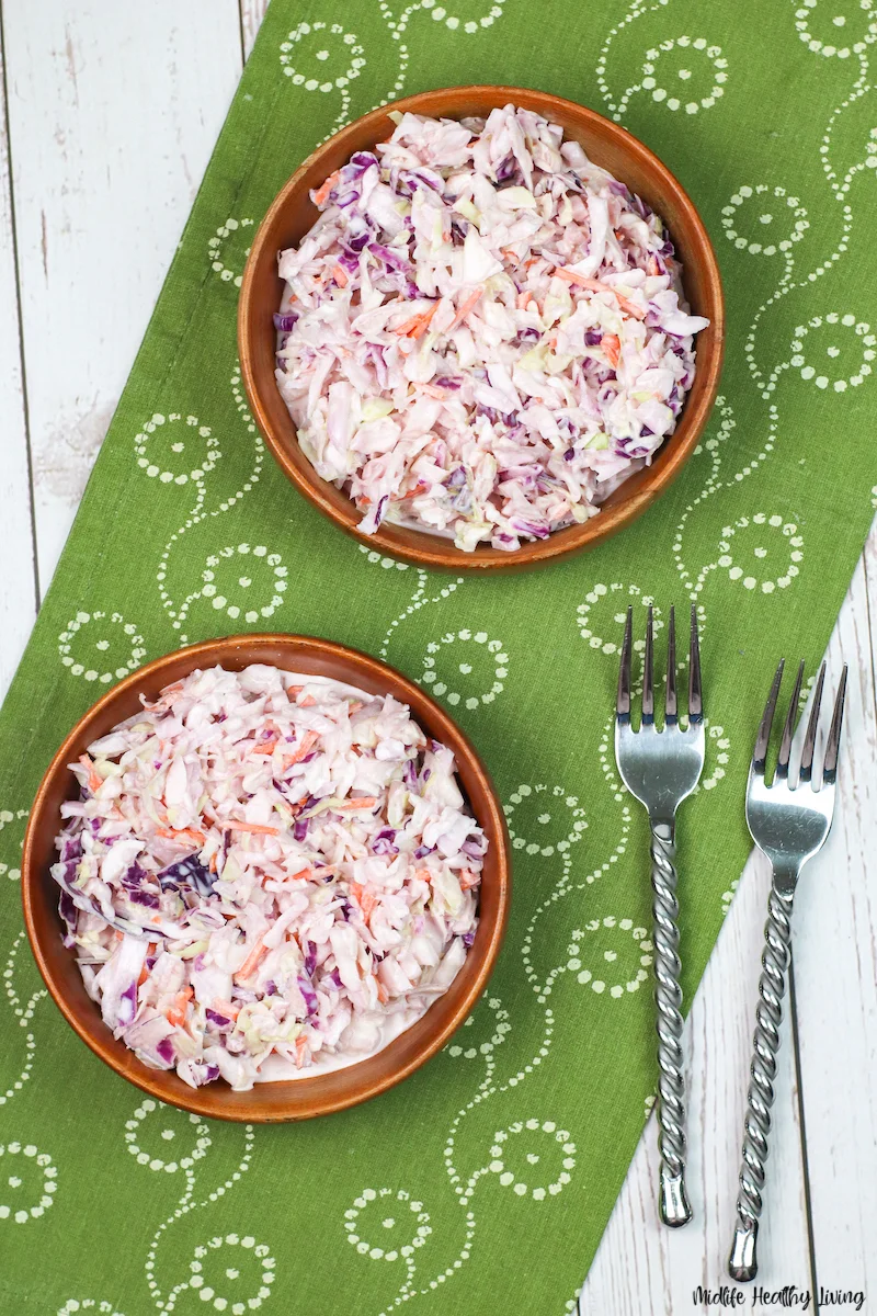 two bowls of finished coleslaw ready to serve. 