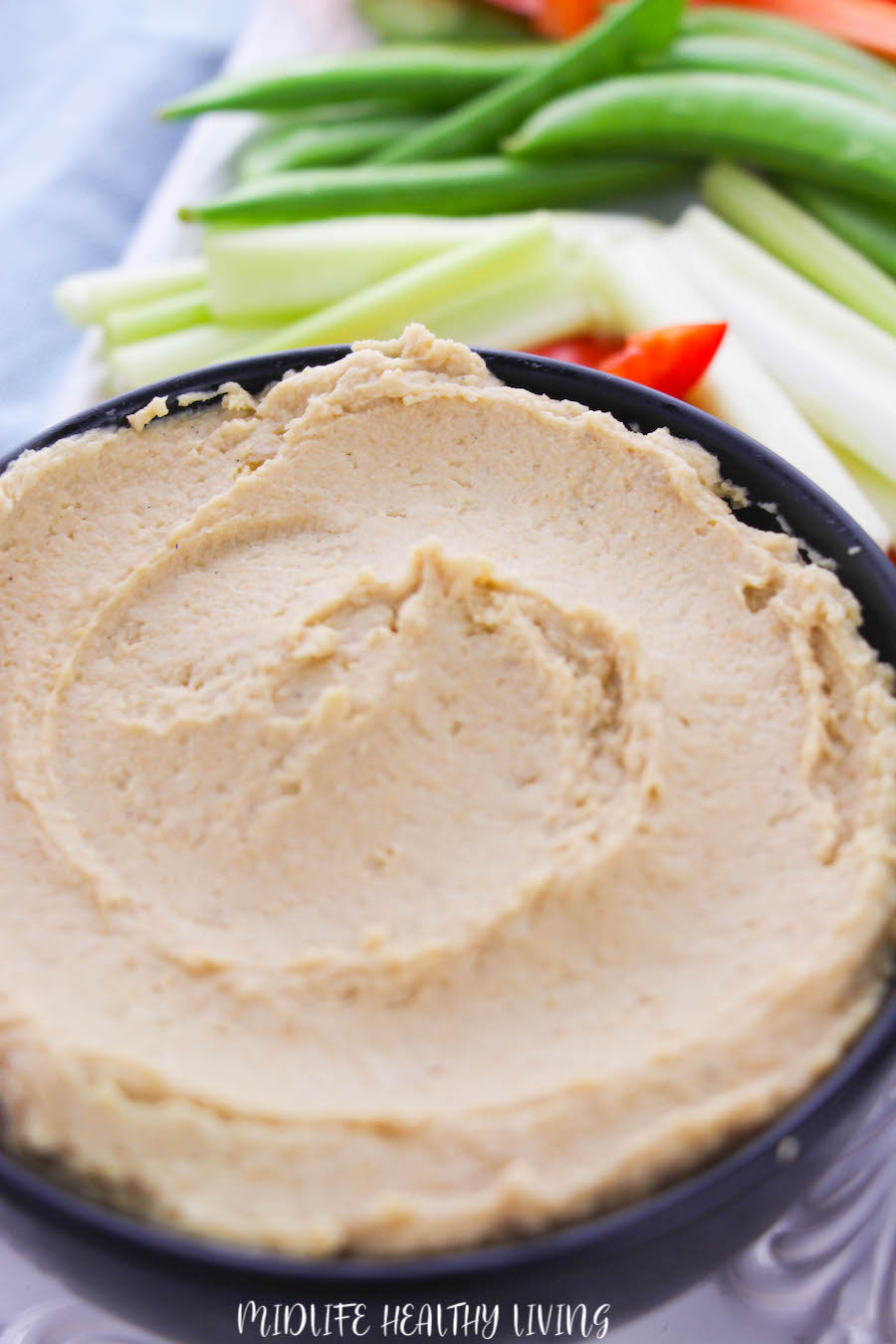 A close up view of the finished creamy hummus ready to eat. 