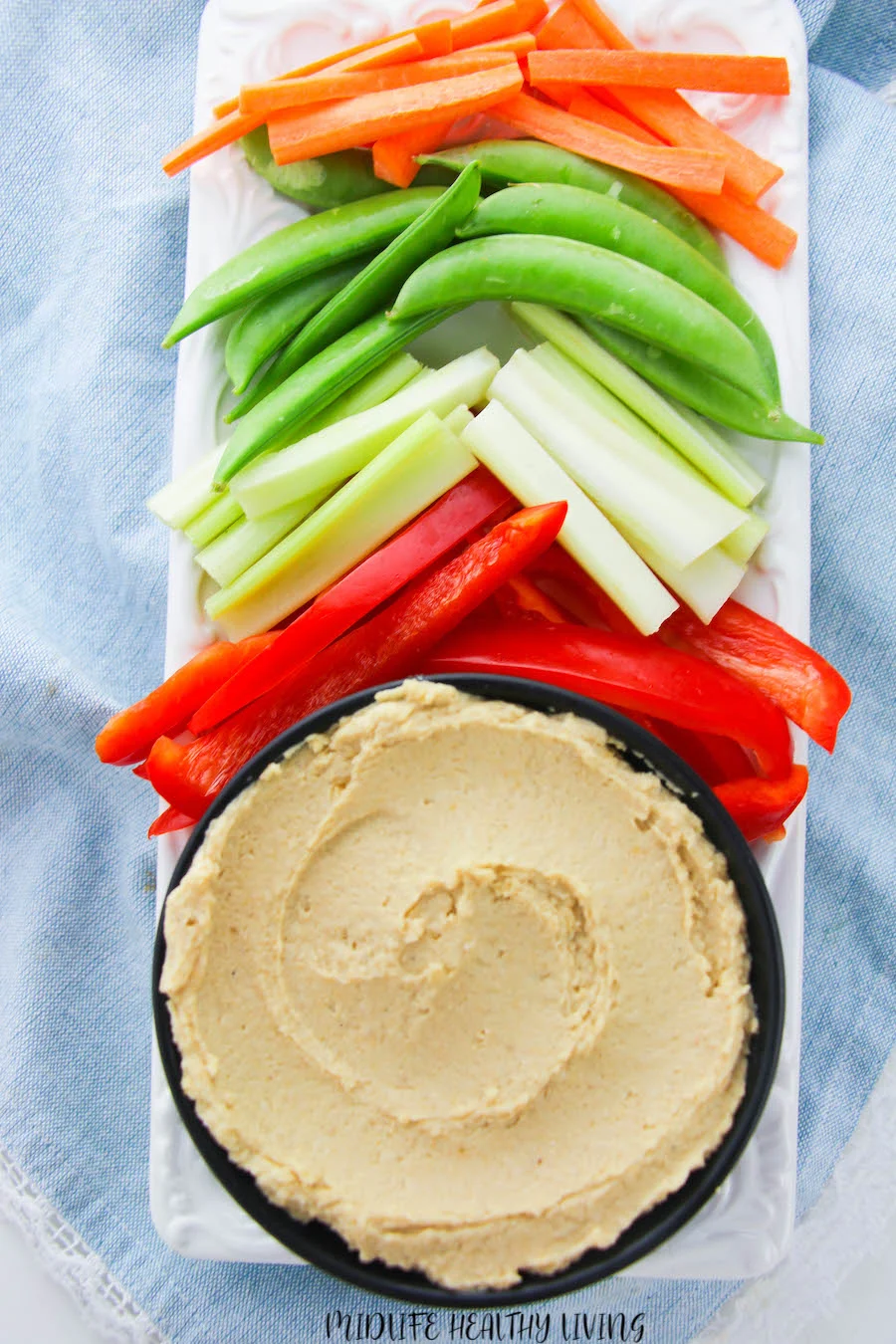A top down look at the weight watchers hummus served with veggies ready to eat. 