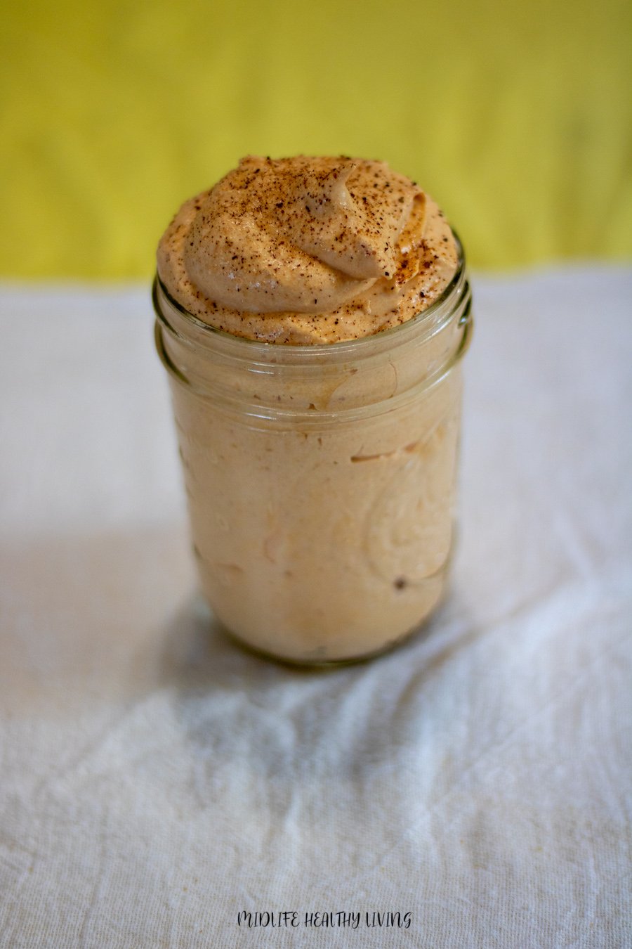 A jar full of the weight watchers pumpkin fluff ready to be enjoyed. 