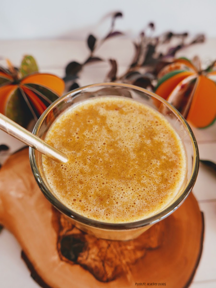 A top down view into the glass of a Weight Watchers pumpkin smoothie ready to be enjoyed. 