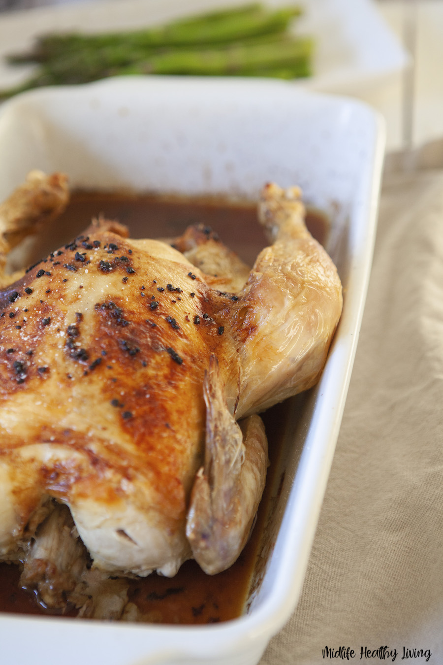 A view of the finished whole roasted chicken ready to be served. 