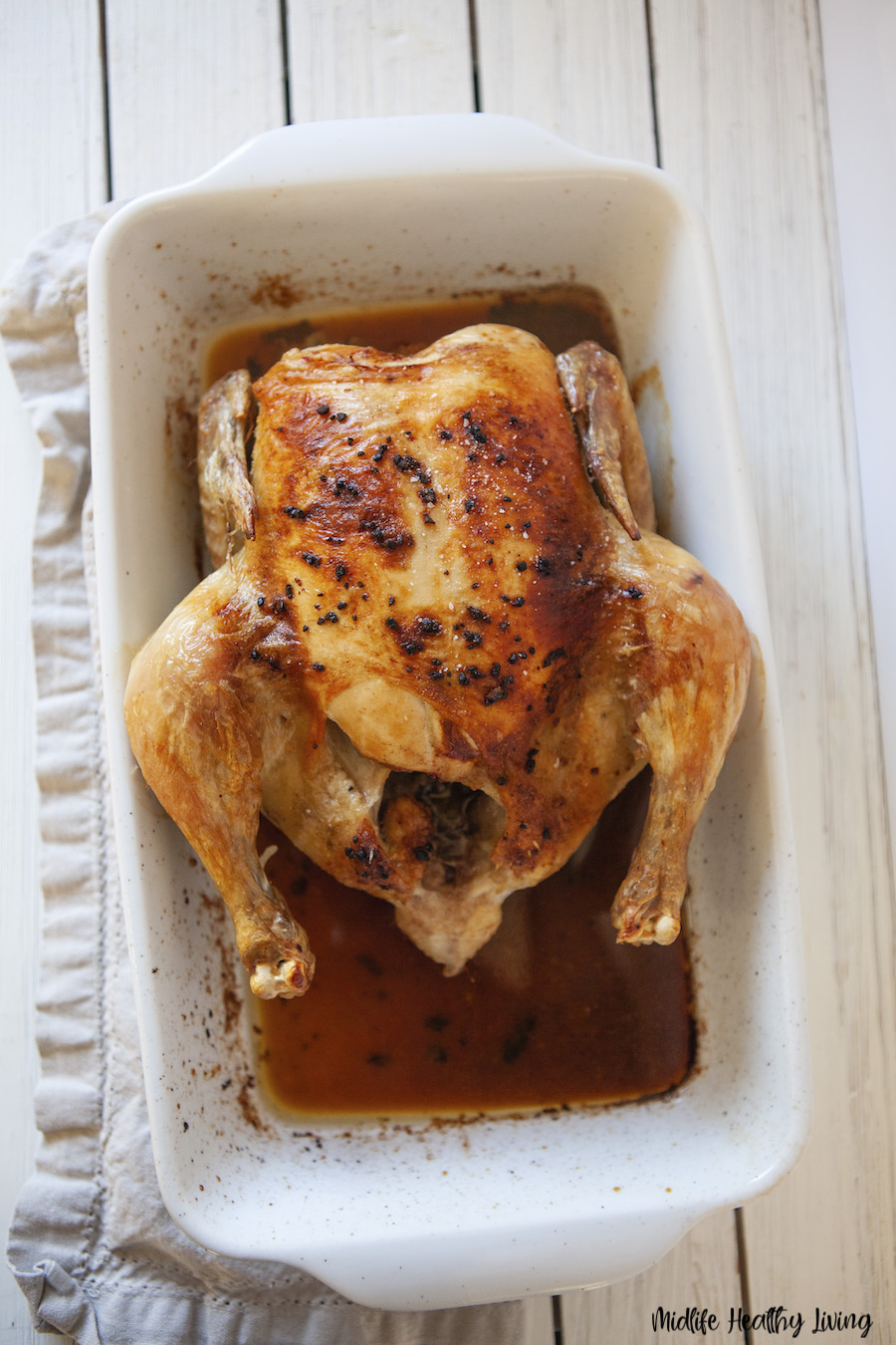 A top down view of the finished whole roasted chicken. 