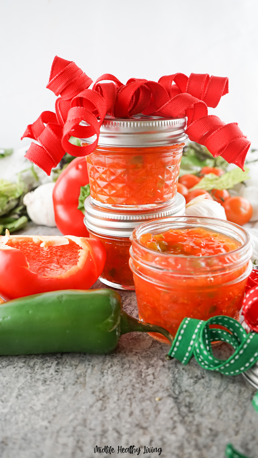 A stack of jars with hot pepper relish ready to eat. 