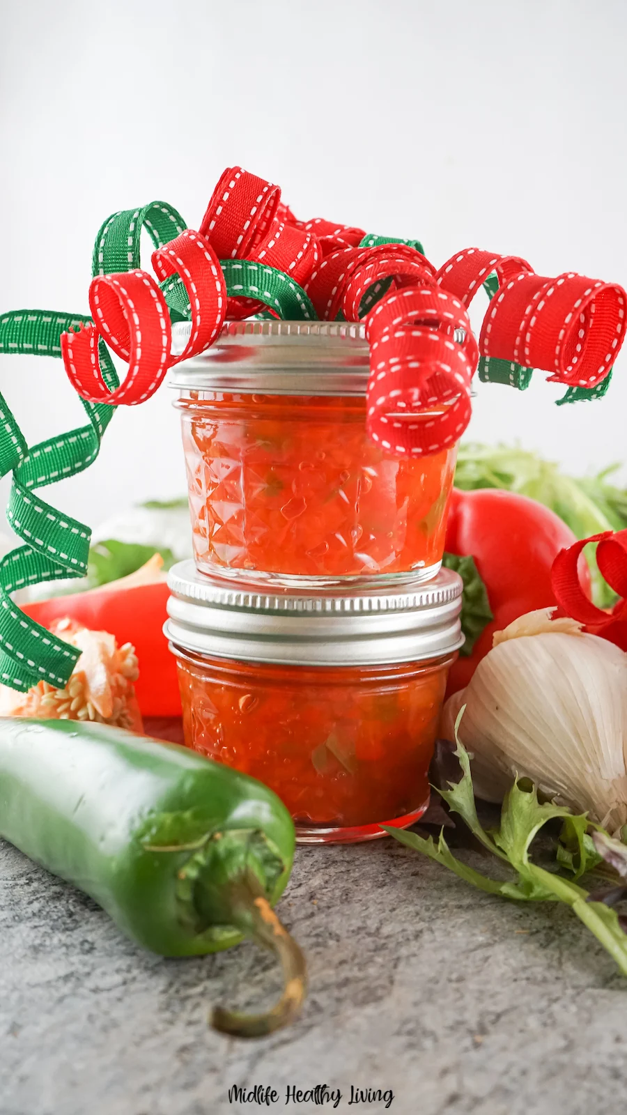 Two jars with giant bows on top ready to be gifted.