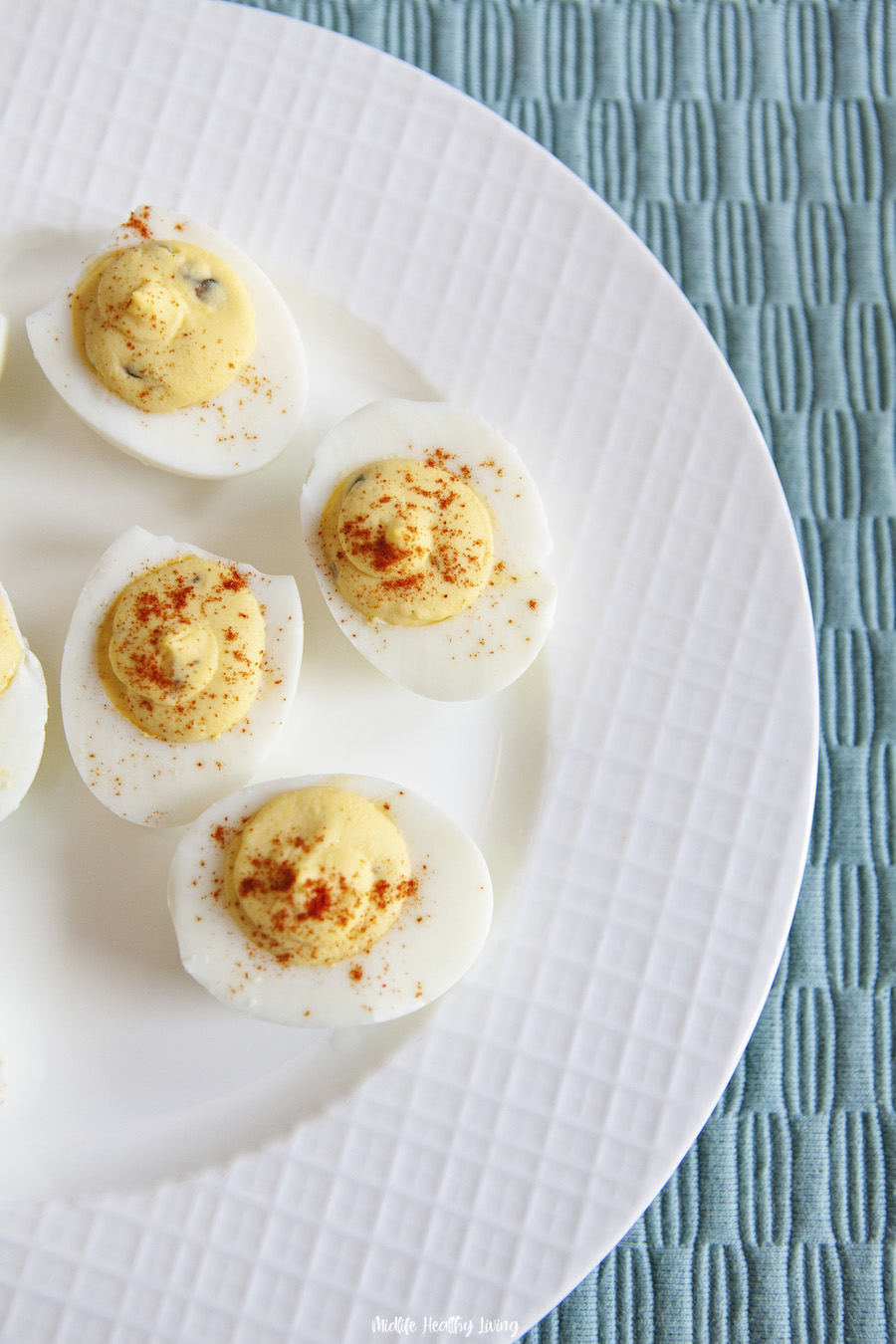 A plate of deviled eggs ready to be shared. 