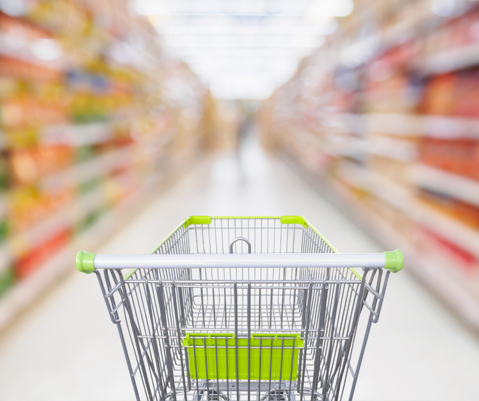 A shopping cart ready to be filled with Aldi green plan foods. 