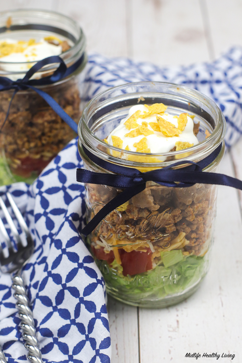 A close up look at the finished taco salad in a jar for weight watchers ready to eat