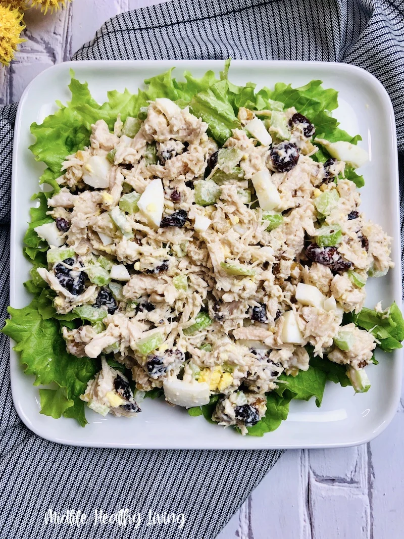 A plate full of finished chicken salad ready to serve. 