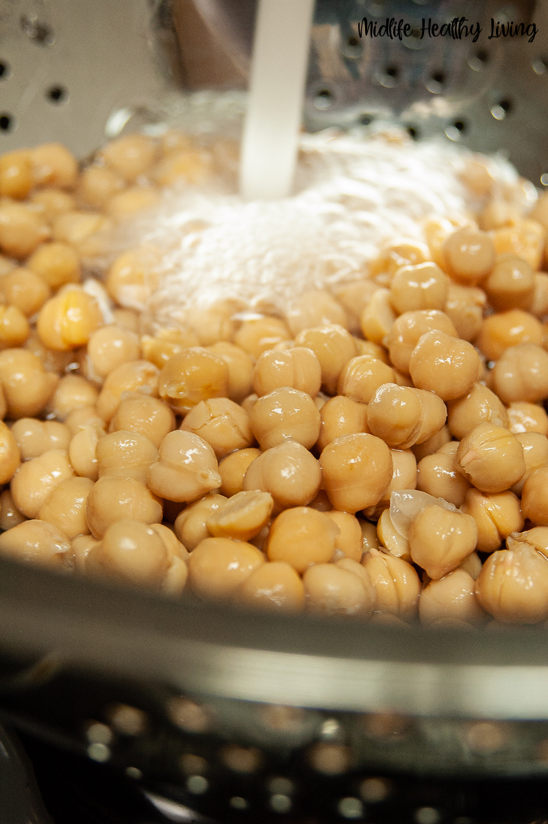 chickpeas being rinsed