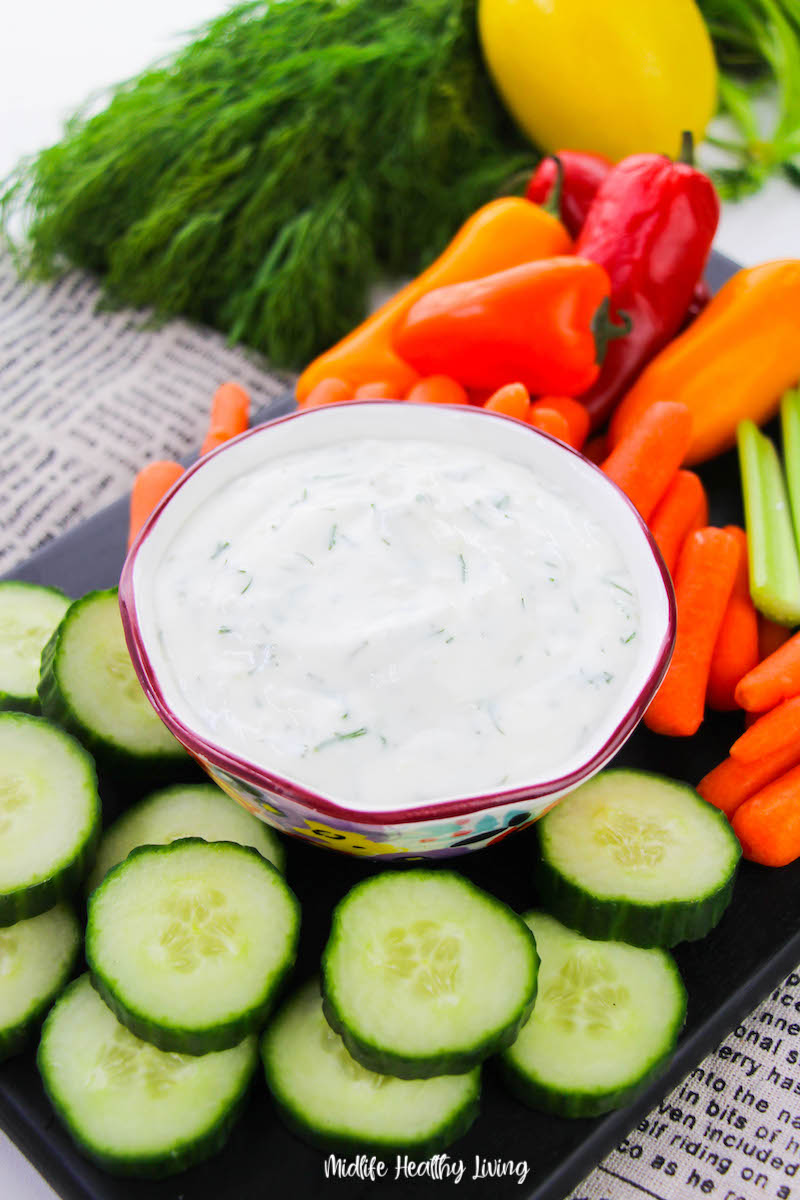 A bowl of the weight watchers dill dip with veggies ready to serve. 