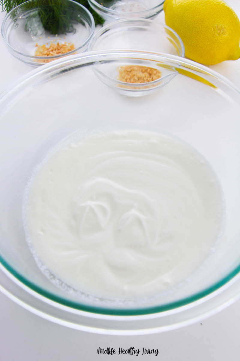 yogurt in the bowl ready to be mixed and seasoned. 