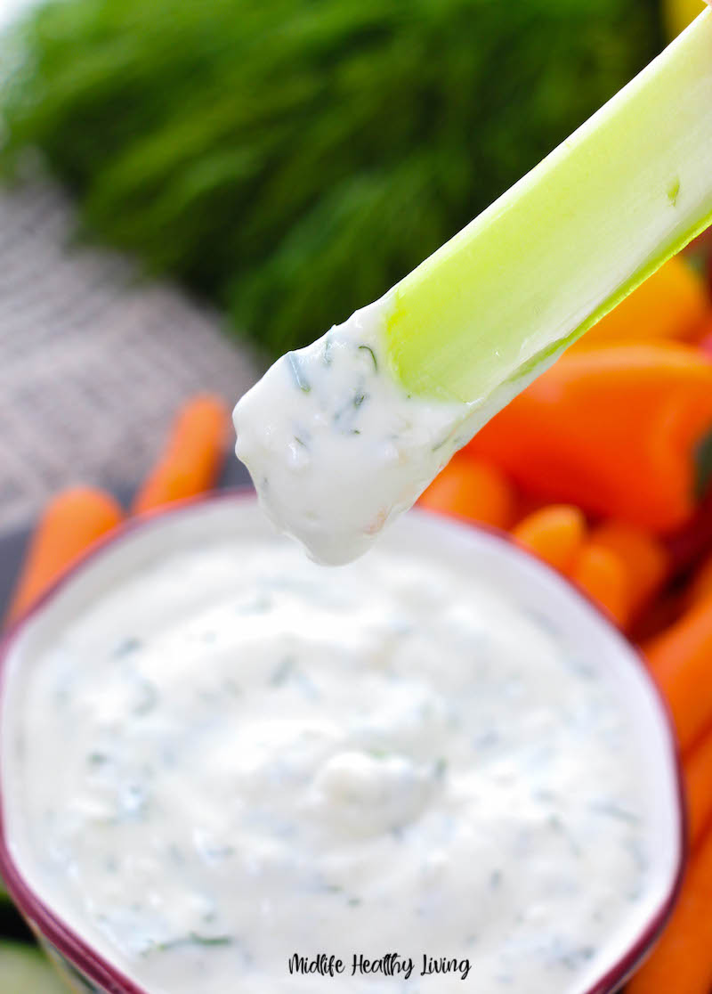 Dip on a piece of celery ready to eat. 