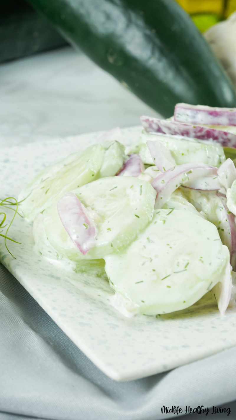 A close up of the finished salad with cucumbers and onions ready to eat. 