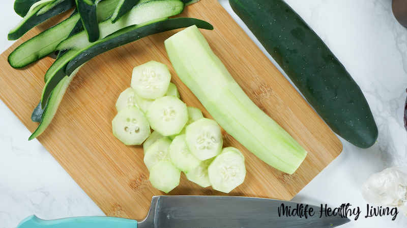 Photo of slicing peeled cucumbers. 