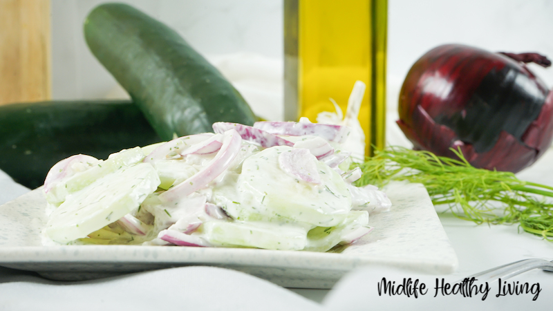 A side view of a plate with a serving of the finished weight watchers cucumber salad on it ready to be enjoyed. 