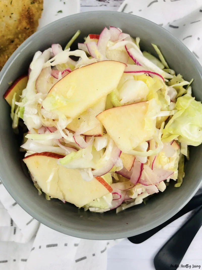 a bowl of the finished weight watchers coleslaw recipe no mayo ready to eat.